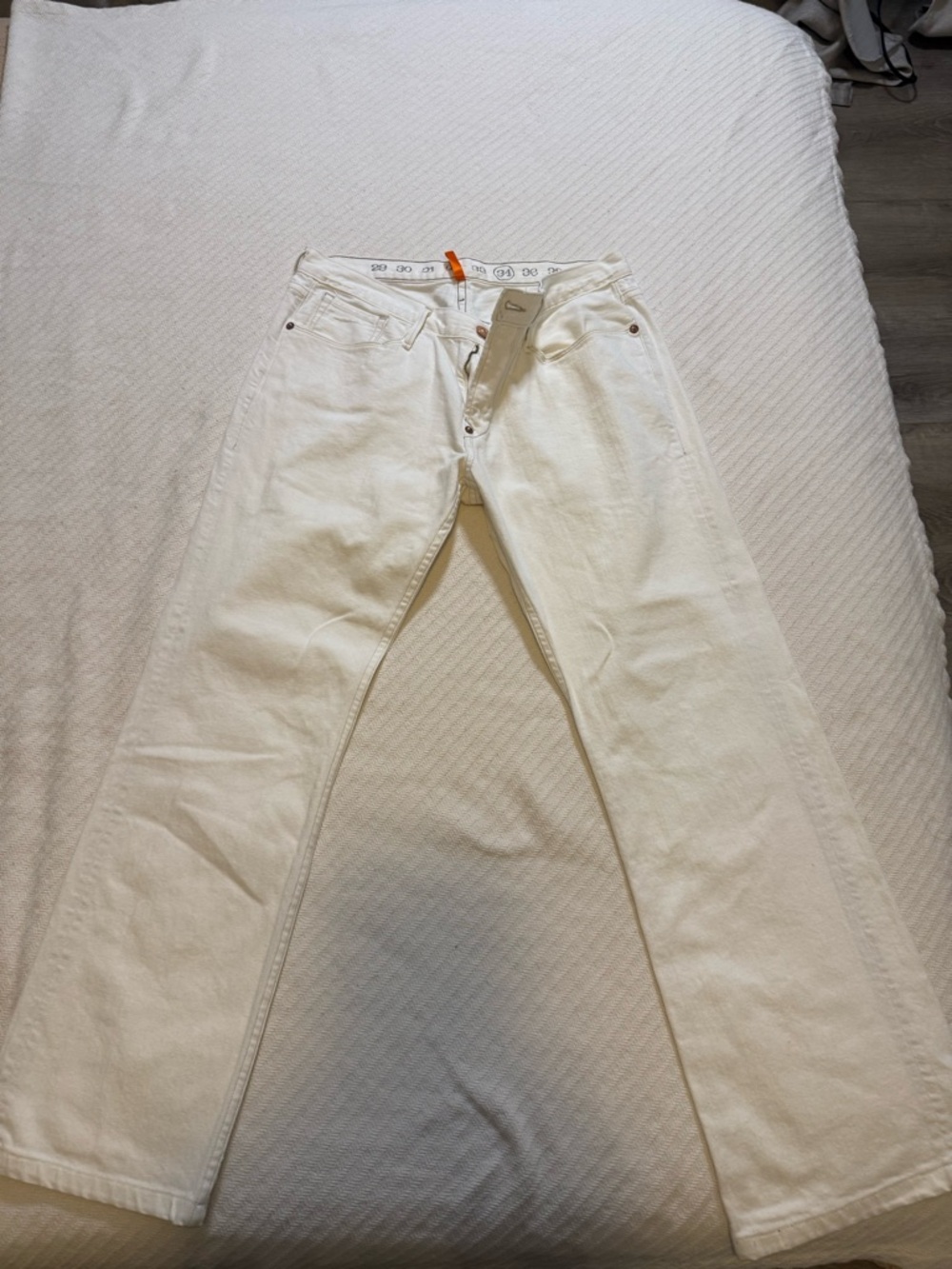 Earnest Sewn white denim jeans with copper rivet